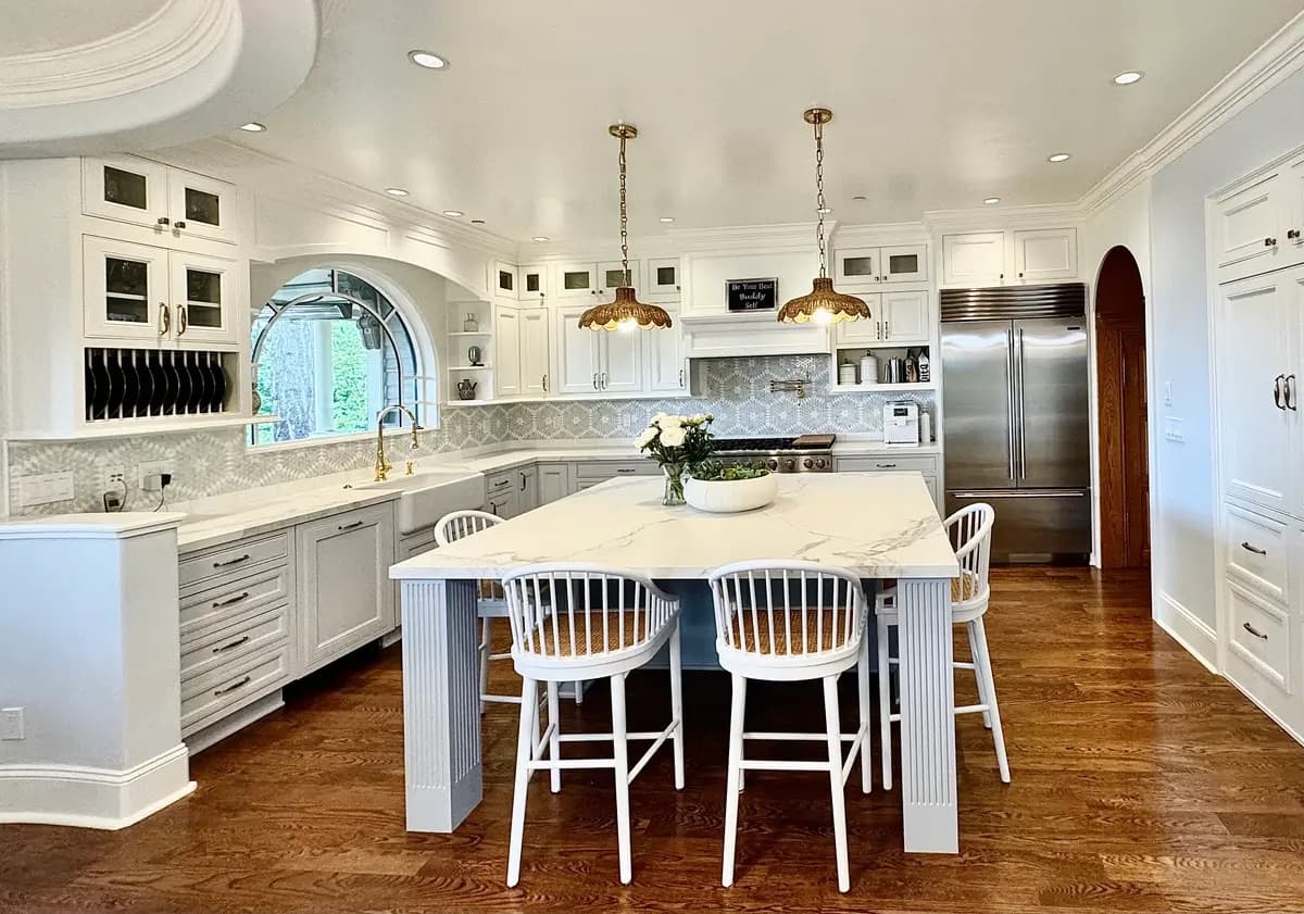 Classic white kitchen with arched window