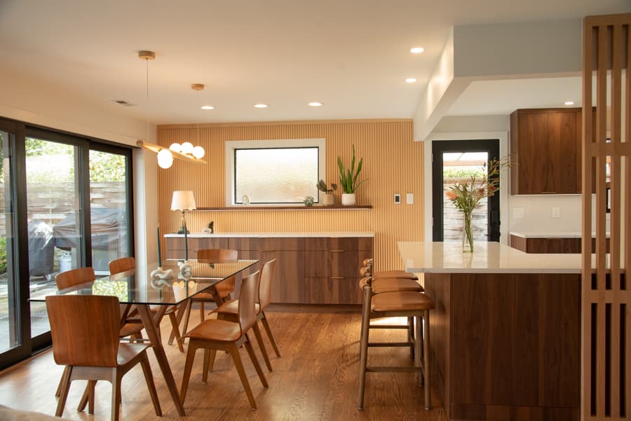 Dining area with mid-century table and sliding glass doors